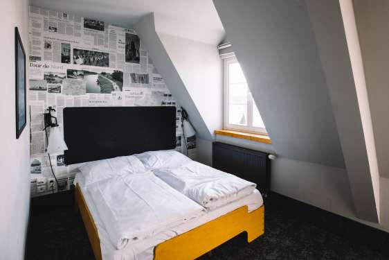 View of the window and bed of the mini double room.