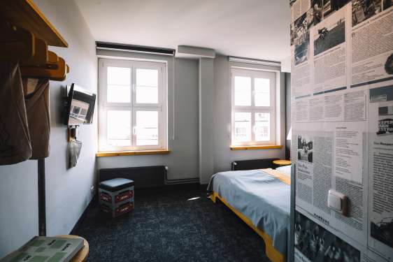 Bright and airy hotel room with a large bed.